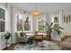 Cozy breakfast nook featuring a built-in bench, decorative lighting, large windows and a round table at 6917 Tanner Hall Blvd, Hanahan, SC 29410