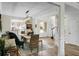 Bright dining room with light wood floors, a decorative chandelier, and stylish furniture at 6917 Tanner Hall Blvd, Hanahan, SC 29410