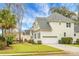 Exterior view of a two story home with an attached garage at 6917 Tanner Hall Blvd, Hanahan, SC 29410