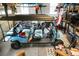 Open garage full of recreational equipment and a large blue golf cart at 6917 Tanner Hall Blvd, Hanahan, SC 29410
