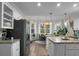 Bright kitchen with granite countertops, stainless steel appliances, and a breakfast nook at 6917 Tanner Hall Blvd, Hanahan, SC 29410