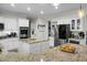 Spacious kitchen with stainless steel appliances, granite counters, custom cabinets and an island at 6917 Tanner Hall Blvd, Hanahan, SC 29410