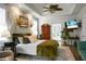 Bright main bedroom featuring stylish wallpaper, ensuite access, and natural light at 6917 Tanner Hall Blvd, Hanahan, SC 29410