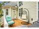 Back patio featuring comfortable seating and a hanging swing chair at 6917 Tanner Hall Blvd, Hanahan, SC 29410