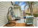 Relaxing covered patio boasts wood floors, stylish seating, rug, and view to the backyard at 6917 Tanner Hall Blvd, Hanahan, SC 29410