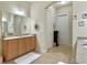 Bright bathroom features double sinks, ample counter space, and neutral tile flooring at 6934 Tanner Hall Blvd, Hanahan, SC 29410