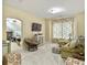 Spacious bonus room with a large TV, neutral carpet and access to storage space at 6934 Tanner Hall Blvd, Hanahan, SC 29410