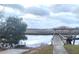 Scenic waterfront view of a dock with a charming gazebo overlooking the tranquil waters at 6934 Tanner Hall Blvd, Hanahan, SC 29410