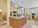 Kitchen island is in an open-concept living area with lots of seating and granite countertops at 6934 Tanner Hall Blvd, Hanahan, SC 29410