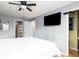 Comfortable bedroom with a ceiling fan, wall-mounted TV, and closet at 700 Daniel Ellis Dr # 8304, Charleston, SC 29412