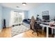 Bedroom with a full sized bed, work desk, and bright sunny window at 700 Daniel Ellis Dr # 8304, Charleston, SC 29412