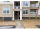 Multi-level condo building features covered entrances and beige siding at 700 Daniel Ellis Dr # 8304, Charleston, SC 29412