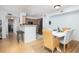 A dining room located just off the kitchen features wood floors and light-colored walls at 700 Daniel Ellis Dr # 8304, Charleston, SC 29412