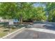 Community entrance and gate with mature landscaping and various community resources at 700 Daniel Ellis Dr # 8304, Charleston, SC 29412
