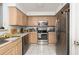 A fully equipped kitchen features stainless steel appliances and light-colored cabinets and countertops at 700 Daniel Ellis Dr # 8304, Charleston, SC 29412