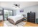 A bright main bedroom features a ceiling fan and a large window with a view at 700 Daniel Ellis Dr # 8304, Charleston, SC 29412