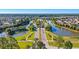 An aerial view of a community with ponds, roads, and lush landscaping on a sunny day at 714 Battery Edge Dr, Summerville, SC 29486