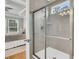 Tiled shower with seamless glass door and a view of the main bedroom at 714 Battery Edge Dr, Summerville, SC 29486