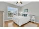 Inviting bedroom with hardwood floors, white furniture, and plenty of natural light at 714 Battery Edge Dr, Summerville, SC 29486