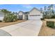 Single-story home featuring an attached two-car garage, neat landscaping, and concrete driveway at 714 Battery Edge Dr, Summerville, SC 29486