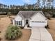 Charming single Gathering home featuring a two car garage, manicured lawn, and neutral color scheme at 714 Battery Edge Dr, Summerville, SC 29486