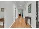 Inviting foyer featuring hardwood floors, neutral paint, and views into the living spaces at 714 Battery Edge Dr, Summerville, SC 29486