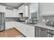 Modern kitchen features white cabinets, stainless steel appliances, and sleek countertops at 714 Battery Edge Dr, Summerville, SC 29486