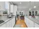 Spacious kitchen with stainless appliances, island with seating, and hardwood floors, great for entertaining at 714 Battery Edge Dr, Summerville, SC 29486