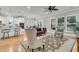 Open living room with hardwood floors flows into the kitchen and eat-in area, perfect for gatherings at 714 Battery Edge Dr, Summerville, SC 29486