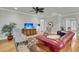 Inviting living room with hardwood floors, neutral paint, ceiling fan and large windows for natural light at 714 Battery Edge Dr, Summerville, SC 29486