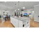 Open floor plan featuring large kitchen island, hardwood floors, and eat in kitchen area at 714 Battery Edge Dr, Summerville, SC 29486