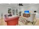 Comfortable living room with large windows, neutral paint, hardwood floors and ceiling fan at 714 Battery Edge Dr, Summerville, SC 29486