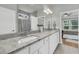 Bathroom featuring double sinks, granite countertops, and a tiled shower in the background at 714 Battery Edge Dr, Summerville, SC 29486