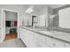 Modern bathroom boasting double sinks, granite countertops, and a walk-in closet at 714 Battery Edge Dr, Summerville, SC 29486