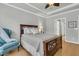 Comfortable bedroom with ceiling fan, a cushioned chair, and views to a connecting bathroom at 714 Battery Edge Dr, Summerville, SC 29486