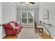 Comfortable home office featuring hardwood floors, neutral paint, and a large window at 714 Battery Edge Dr, Summerville, SC 29486