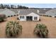 Aerial view of the home's rear exterior, back yard and screened in porch at 714 Battery Edge Dr, Summerville, SC 29486