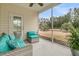Cozy screened porch with stylish outdoor seating and view of the backyard at 714 Battery Edge Dr, Summerville, SC 29486