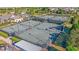 Overhead view of tennis courts with professional fencing surrounded by lush landscaping and manicured walking paths at 714 Battery Edge Dr, Summerville, SC 29486