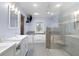 Bathroom featuring glass shower, double sinks, large mirror, and a bathtub with jets at 7537 Parkers Ferry Rd, Adams Run, SC 29426
