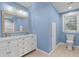 Elegant bathroom with a double sink vanity and modern fixtures at 7537 Parkers Ferry Rd, Adams Run, SC 29426