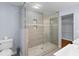 Bathroom featuring glass shower with built-in shelves and a vessel sink at 7537 Parkers Ferry Rd, Adams Run, SC 29426