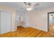 Spacious bedroom featuring wood floors, neutral walls and ample closet space at 7537 Parkers Ferry Rd, Adams Run, SC 29426