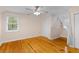 Bright bedroom featuring wood floors, neutral walls and ample closet space at 7537 Parkers Ferry Rd, Adams Run, SC 29426