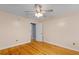 Neutral bedroom with hardwood floors and access to another room at 7537 Parkers Ferry Rd, Adams Run, SC 29426