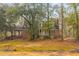 Charming brick home with a cozy porch and lots of tree coverage at 7537 Parkers Ferry Rd, Adams Run, SC 29426