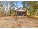 Charming home with a covered carport, brick siding, mature trees, and a spacious front yard at 7537 Parkers Ferry Rd, Adams Run, SC 29426