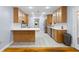 Eat-in kitchen with bright white counters, stainless steel appliances, and light wood cabinetry at 7537 Parkers Ferry Rd, Adams Run, SC 29426