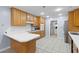 Eat-in kitchen with bright white counters, stainless steel appliances, and light wood cabinetry at 7537 Parkers Ferry Rd, Adams Run, SC 29426
