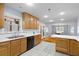 Eat-in kitchen with bright white counters and light wood cabinetry connected to living area at 7537 Parkers Ferry Rd, Adams Run, SC 29426